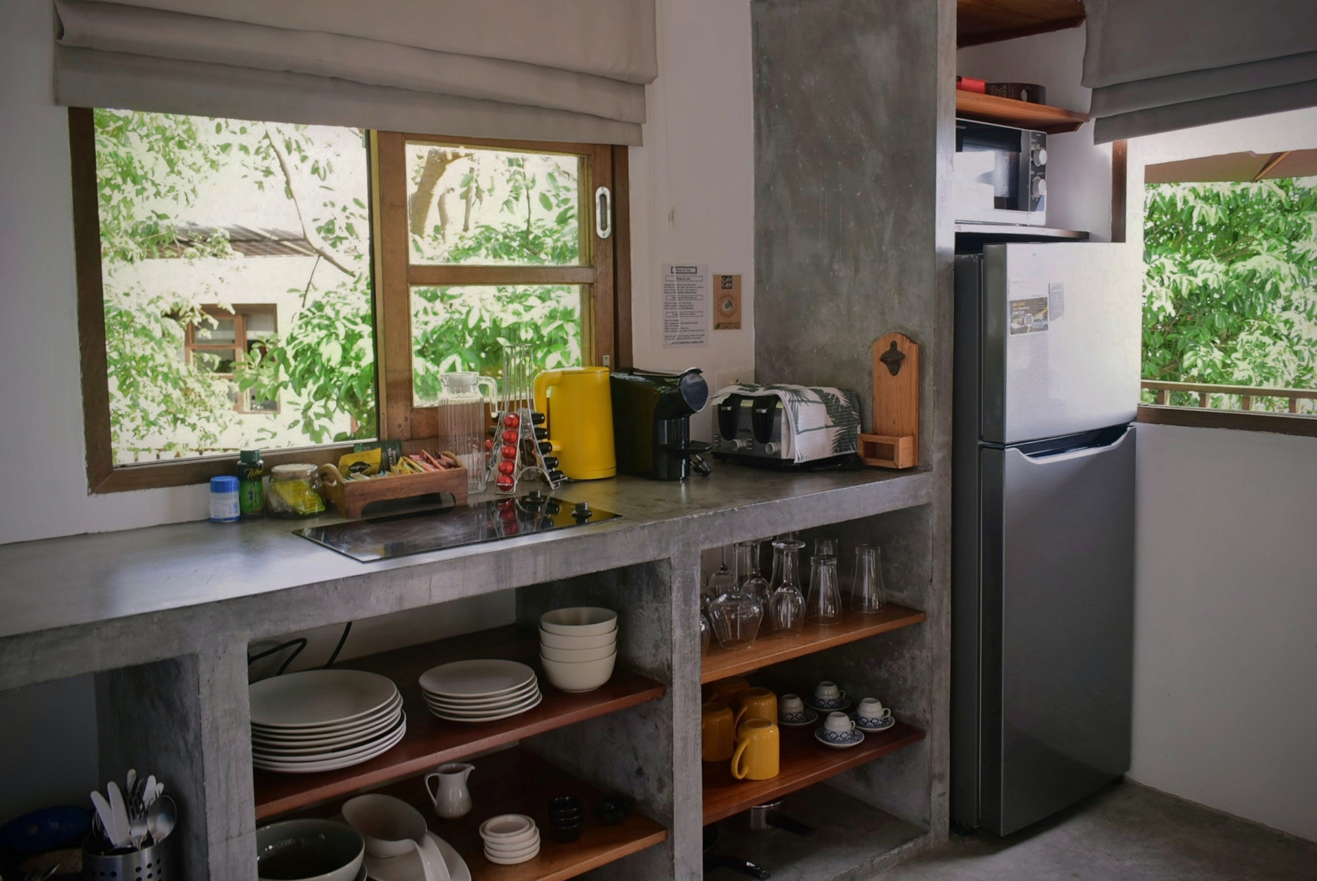 Well-equipped kitchen with garden view at The Trevally House