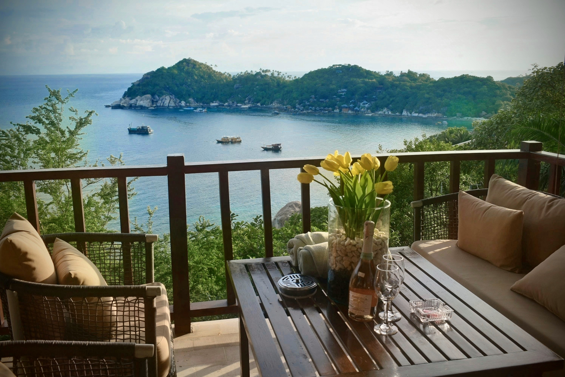 Terrace seating with table and ocean view at The Trevally House