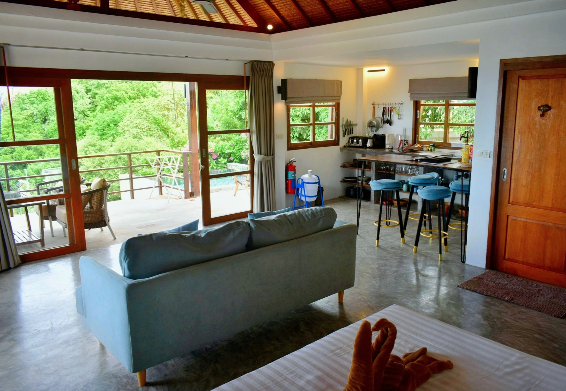 Open-plan living and kitchen with garden view in The Sailfish House